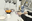 Learning Goal-Directed Object Pushing in Cluttered Scenes with Location-Based Attention