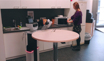 Where Can I Help? Human-Aware Placement of Service Robots